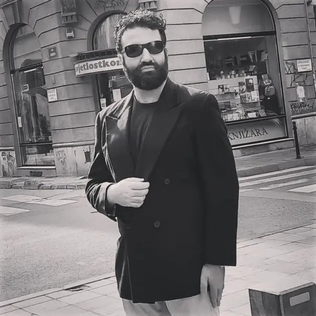 Leon Papo wearing a vintage Giorgio Armani Black Label double breasted blazer