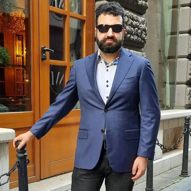 Leon Papo wearing a Canali navy blazer. 