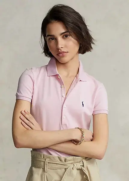A model  wearing a Polo Ralph Lauren polo shirt. 