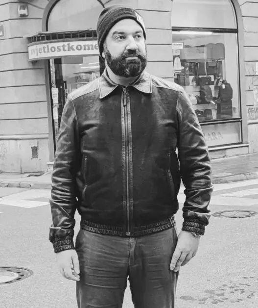 Leon Papo wearing A Prada Linea Rossa leather jacket